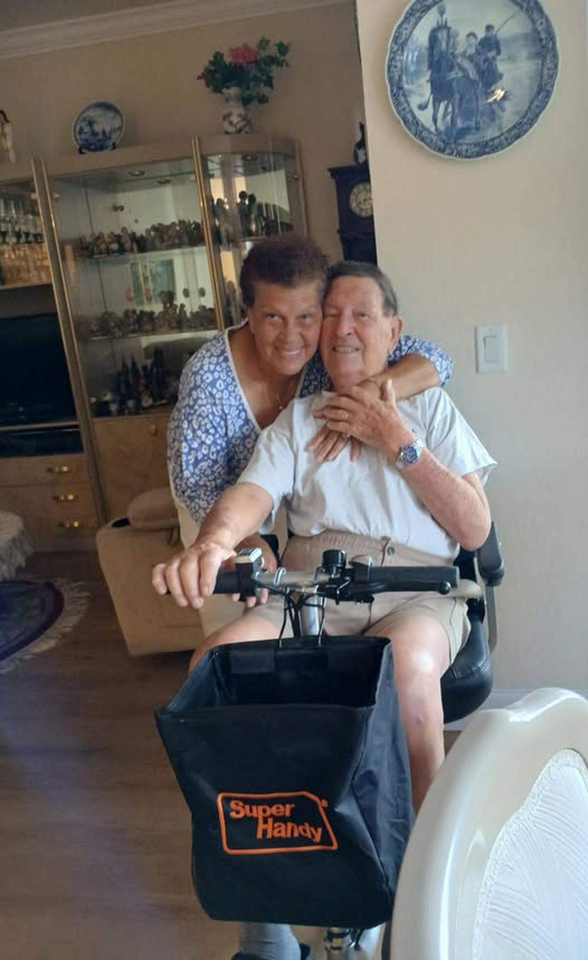 Bernhard Lukoschek, seated, and his wife Hyacinth Lukoschek, at their Miramar home. The Lukoscheks donated a scooter to the Multiple Sclerosis Foundation in South Florida after reading a Miami Herald Wish Book story in December 2024.