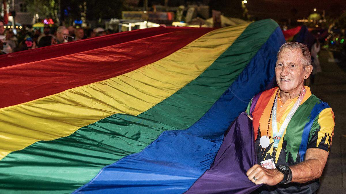 Parade-goers carry the rainbow Pride flag during the 2024 Wilton Manors Stonewall Pride Parade and Street Festival. Wilton Manors is known as South Florida’s gay neighborhood.