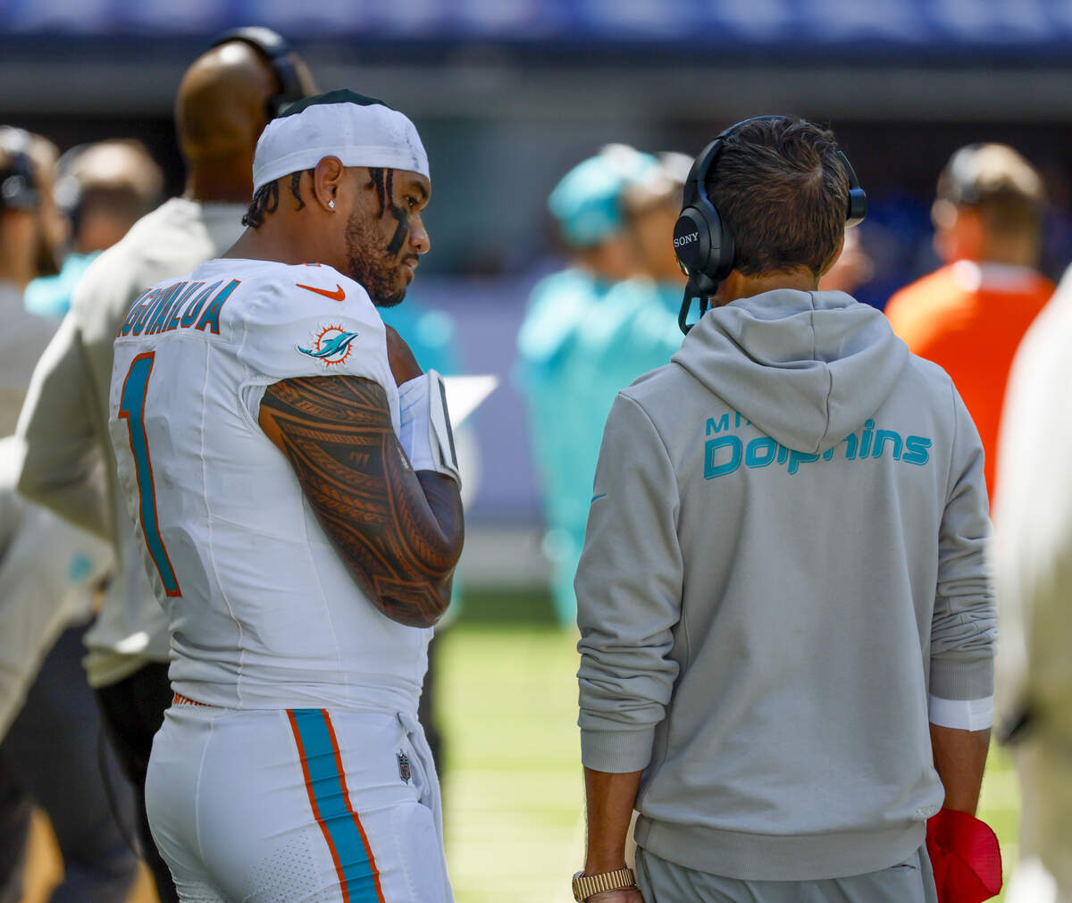 Miami Dolphins quarterback Tua Tagovailoa (1) talks with Miami Dolphins head coach Mike McDaniel during the first half of an NFL game against the Indianapolis Colts at Lucas Oil Stadium on Sunday, September 7, 2025, in Indianapolis, Indiana.