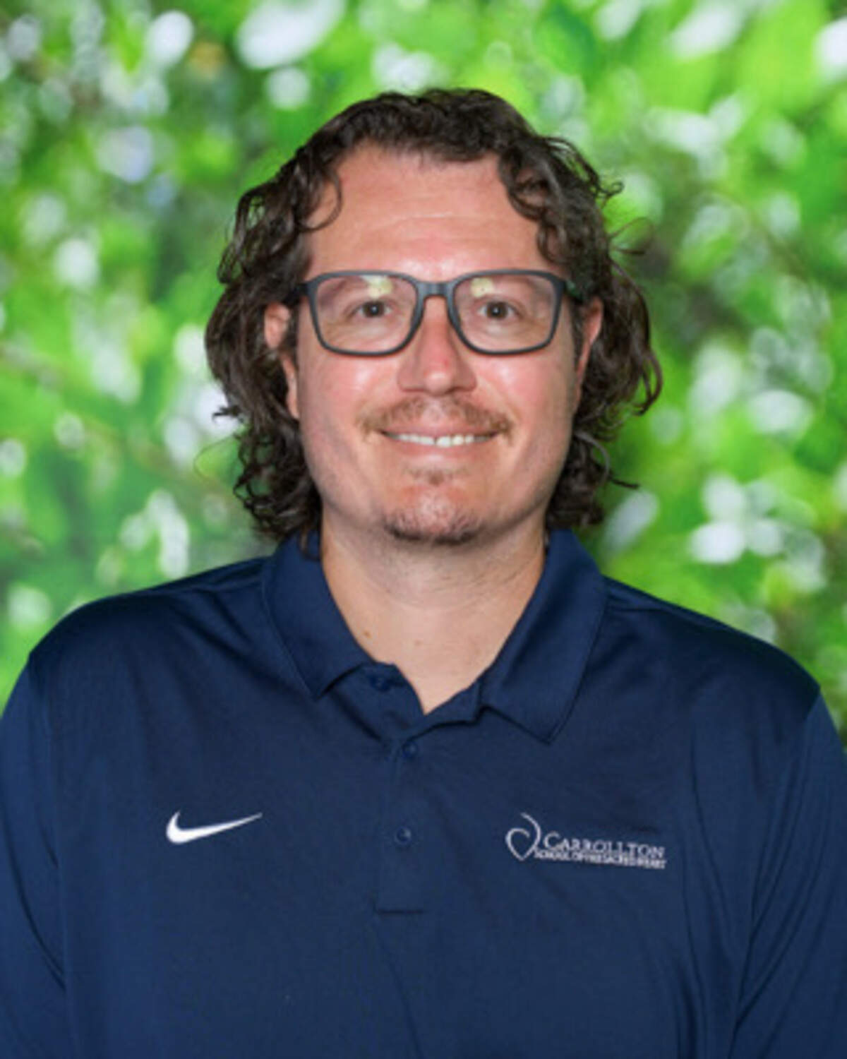 Carrollton track and field coach Dylan Hermelee
