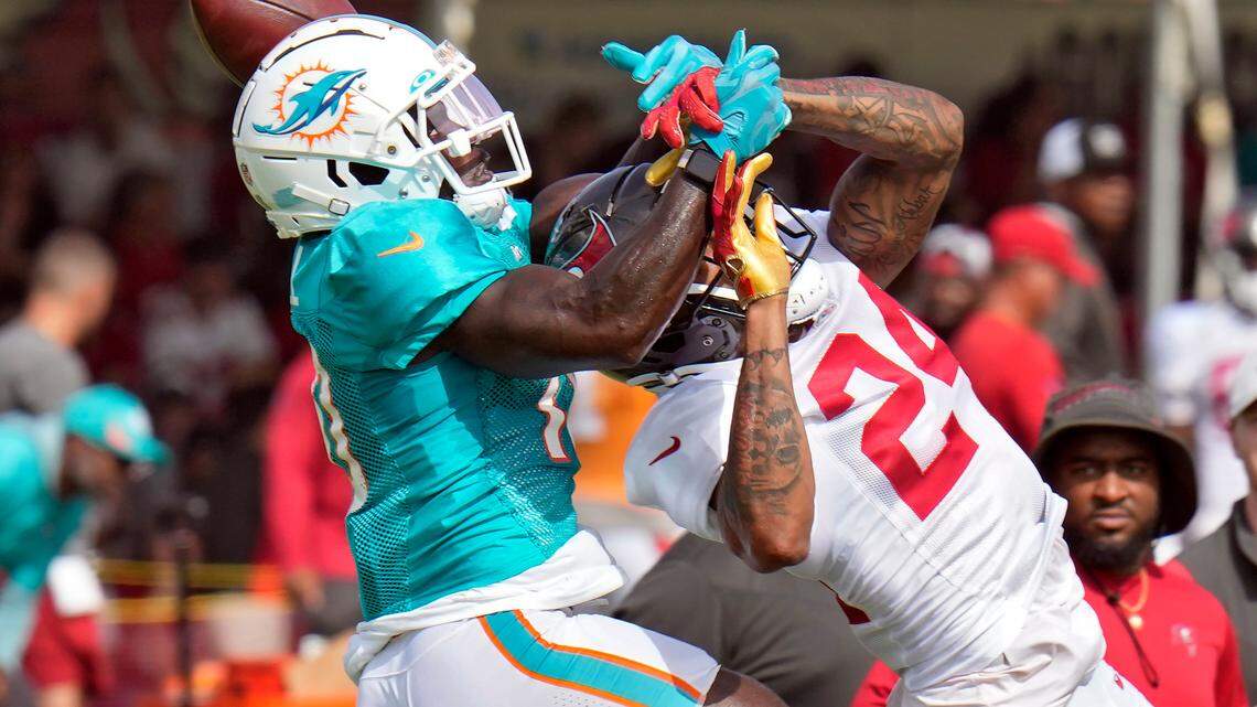 Tampa Bay Buccaneers Carleton Davis III (24) breaks up a pass intended for Miami Dolphins wide receiver Tyreek Hill (10) during an NFL football training camp practice Wednesday, Aug. 10, 2022, in Tampa, Fla. (AP Photo/Chris O’Meara)