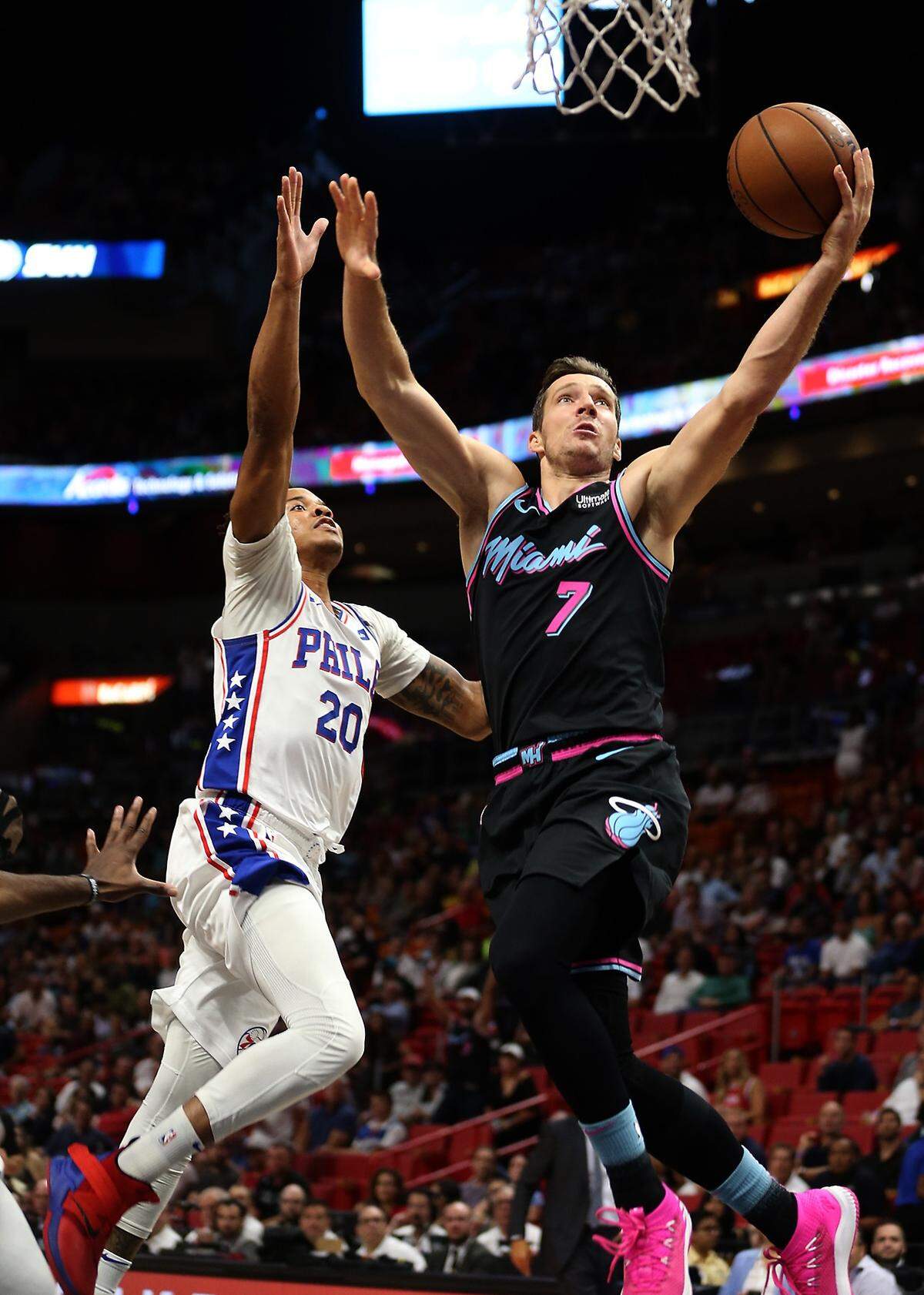 The Heats #7 Goran Dragic dives to the basket past the 76ers #20 Markelle Fultz as the Miami Heat host the Philadelphia 76ers on Monday, November 12, 2018.