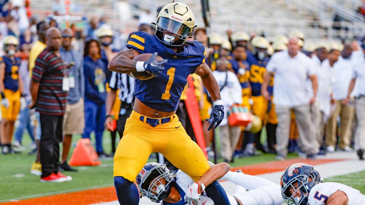 St. Thomas Aquinas running back Jordan Lyle (1) takes it to the goal line as Homestead Broncos Jakhai Rainey (9) makes the stop in the first half of the Class 3M state championship at Bragg Memorial Stadium in Tallahassee, Florida, on Saturday, December 9, 2023.