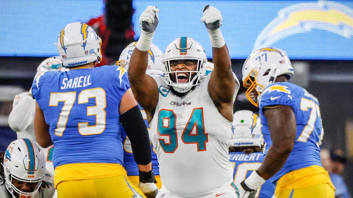 Miami Dolphins Christian Wilkins celebrates after sacking Los Angeles Chargers quarterback Justin Herbert (10) in the first quarter at SoFi Stadium in Inglewood, California on December 11, 2022.