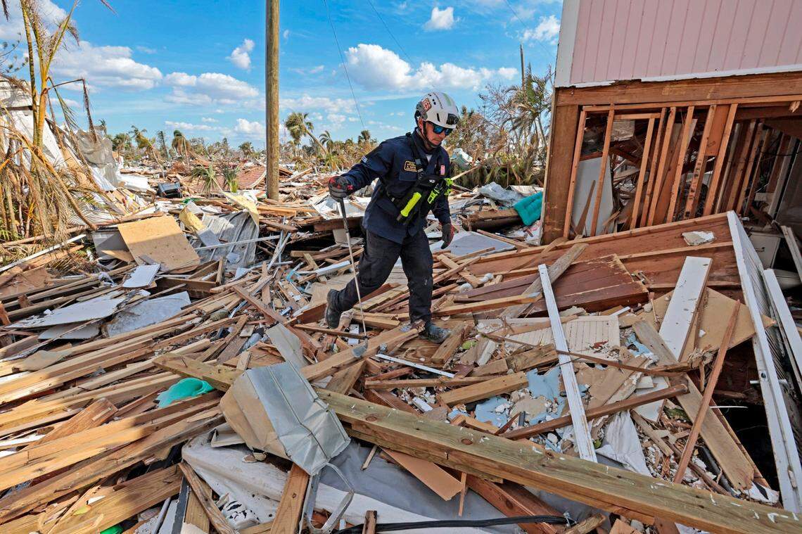 Urban Search and Rescue Florida Task Force 2 team member R. Martin searches the damaged homes on Fort Myers Beach on Monday, Oct. 3, 2022.