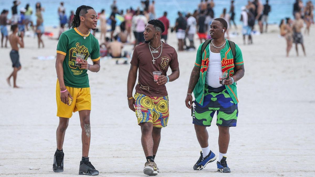 Alabama State University spring breakers Jacory Lee, 21, Justin Stephens, 22, and Terry Haynes, 22, walk on South Beach on Thursday, March 17, 2022.