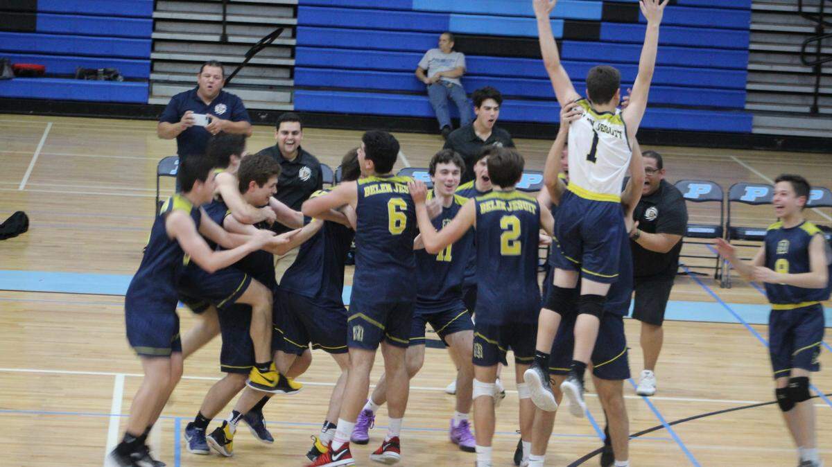 Belen players storm the court following the clinching point of their 3-0 sweep of Palmetto in a regional final at Palmetto High School on Thursday night clinching the program’s first ever trip to the state tournament.