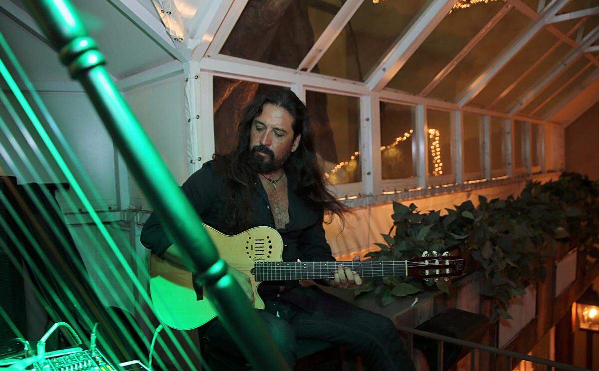 Pablo Mendoza performs on guitar at Perricone’s in 2015.