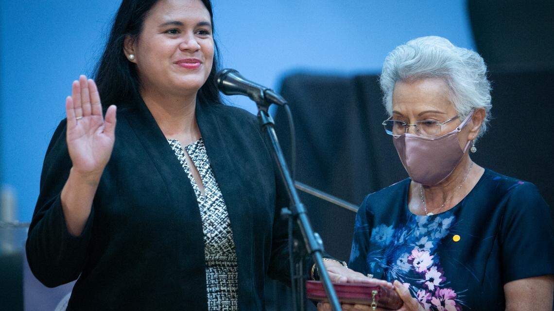 Miami-Dade School Board Member Lucia Baez-Geller, being sworn in above, sponsored the item to designate October at LGBTQ History Month in Miami-Dade Schools. Board Member Christi Fraga voted against the measure, which passed 7-1.