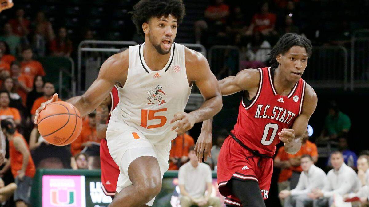 UM Hurricanes forward Norchad Omier (15) drives to the basket during basketball game against NC State Wolfpack on Saturday, December 10, 2022 at Watsco Center in Coral Gables. Andrew Uloza / for Miami Herald