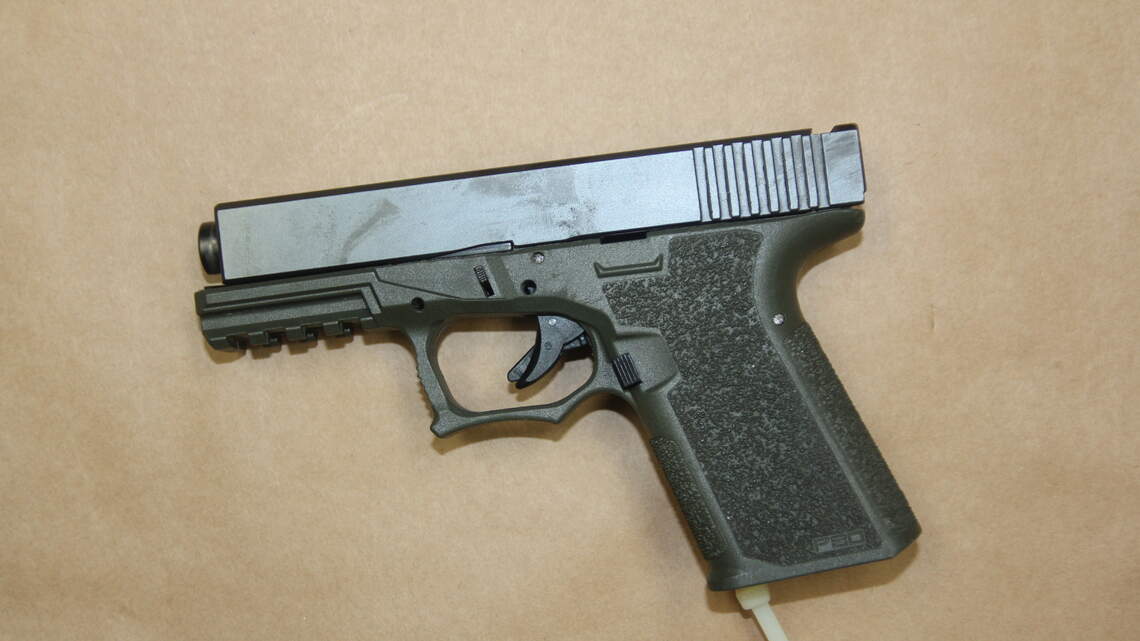 Detectives say they found a stolen gun and illegally modified Glock in Keys home