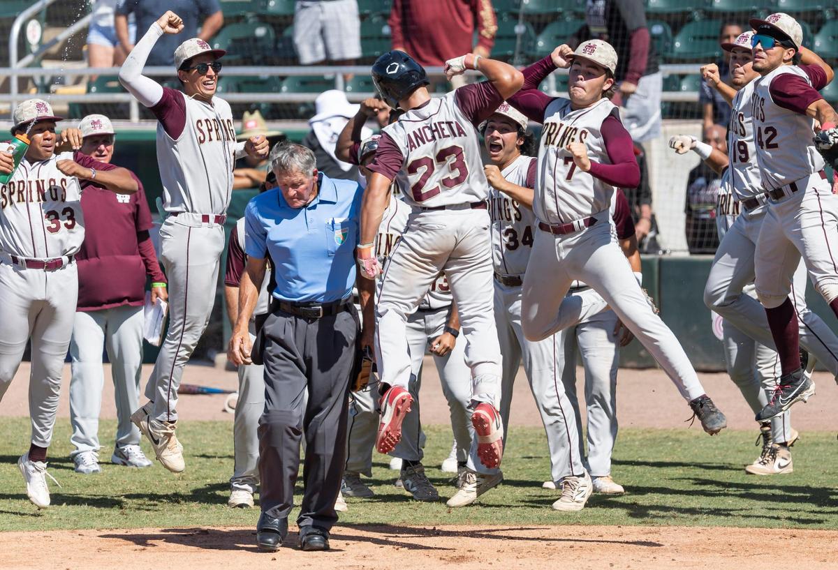 Miami Springs Golden Hawks outfielder Taylor Ancheta (23) celebrates with his team after hitting a home run against the South Walton Seahawks in the second inning of their Class 3A state baseball championship game at Hammond Stadium on Tuesday, May 20, 2025, in Fort Myers, Fla.