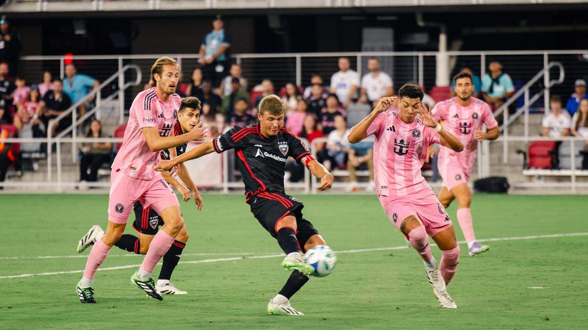 Aug 23, 2025; Washington, District of Columbia, USA; D.C. United midfielder Jackson Hopkins (25) shoots the ball for a goal while Inter Miami midfielder Tomas Aviles (6) and defender Ryan Sailor (15) defend in the first half at Audi Field. Mandatory Credit: Emily Faith Morgan-Imagn Images