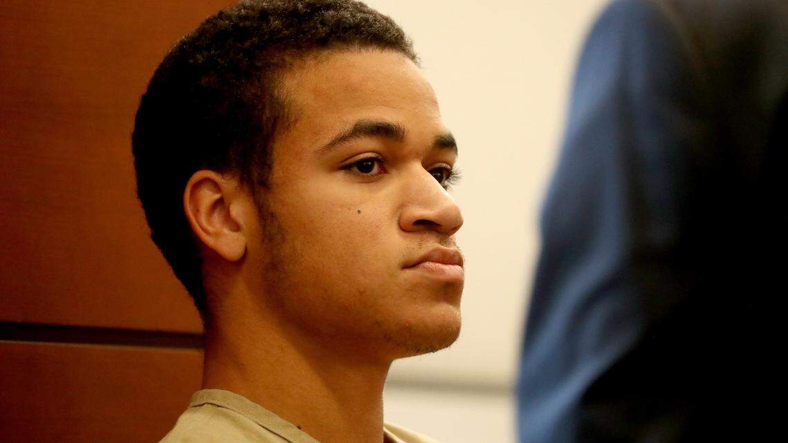 Zachary Cruz, 18, brother of the teenager who killed 17 people at Marjory Stoneman Douglas High, sits in court after he was arrested for trespassing at the school in March.