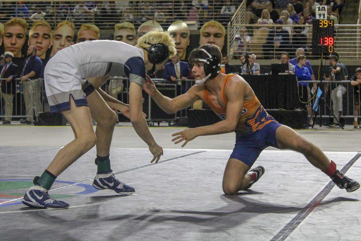Mater Lakes’ Nicholas Luna (right) competes against Delray American Heritage’s Vicenzo Napolitana in the Class 1A, 120 lbs state final on Saturday, March 9, 2019 at Silver Spurs Arena in Kissimmee, Florida