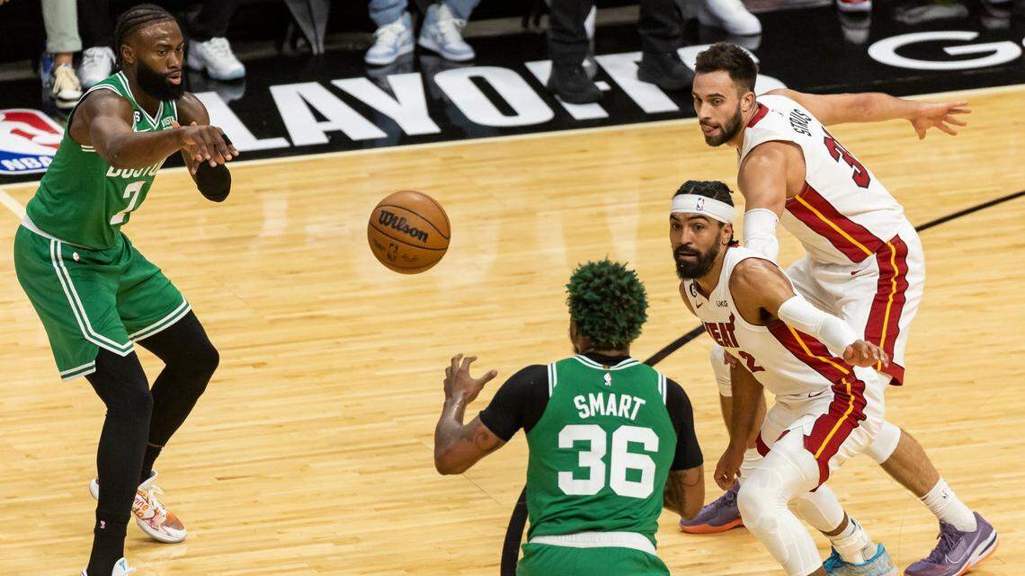 Boston Celtics guard Jaylen Brown (7) passes to guard Marcus Smart (36) as Miami Heat guards Gabe Vincent (2) and Max Strus (31) defend during the first quarter in Game 6 of the NBA Eastern Conference Finals at the Kaseya Center on Saturday, May 27, 2023, in downtown Miami, Fla.