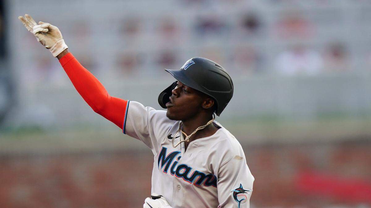 Miami Marlins’ Jazz Chisholm Jr. gestures as he runs the bases after hitting a solo home run during the first inning of the team’s baseball game against the Atlanta Braves on Saturday, April 23, 2022, in Atlanta.