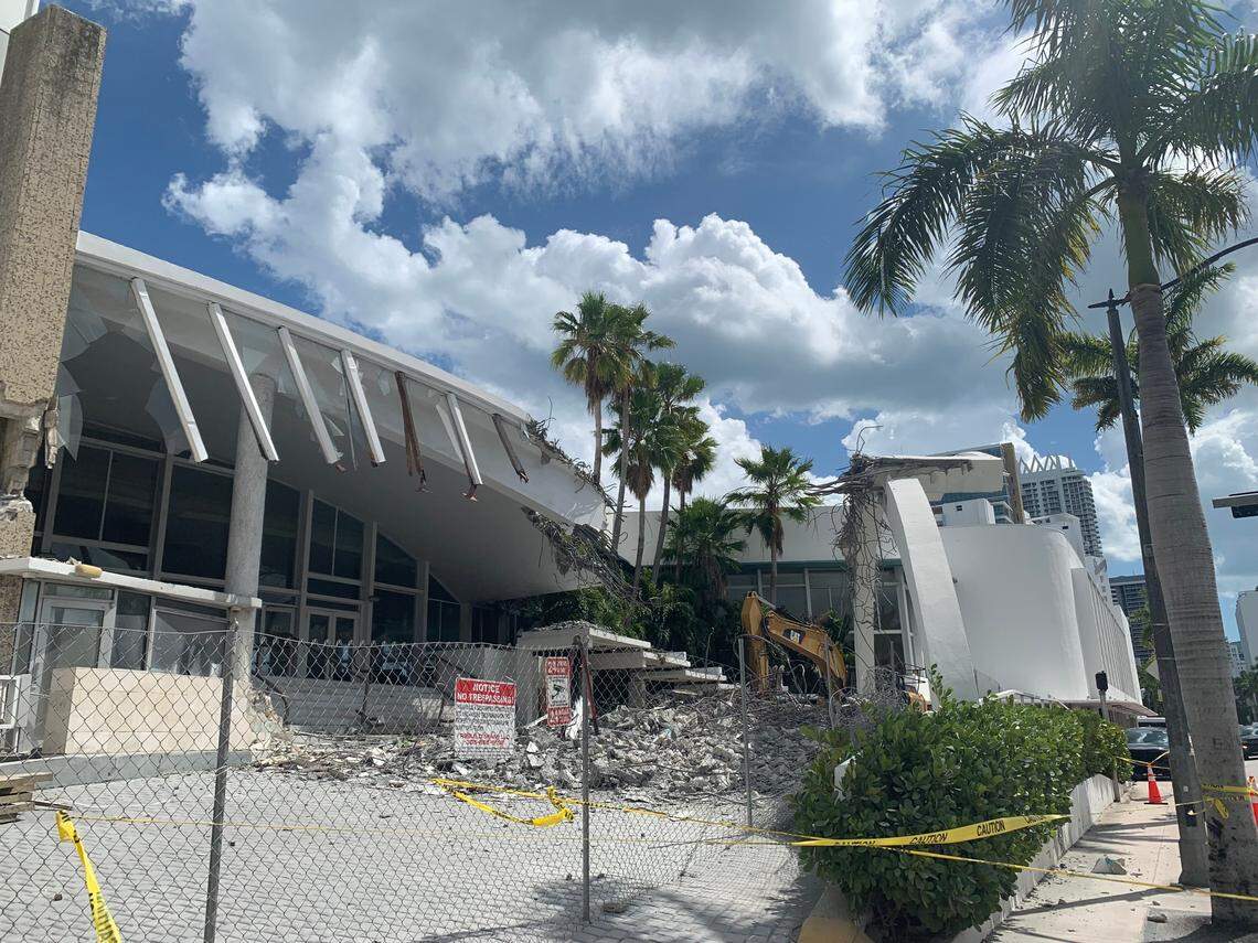Workers tore down part of the Deauville Beach Resort’s front entrance on March 12, 2022, days after the city of Miami Beach issued a permit to demolish the historic building.
