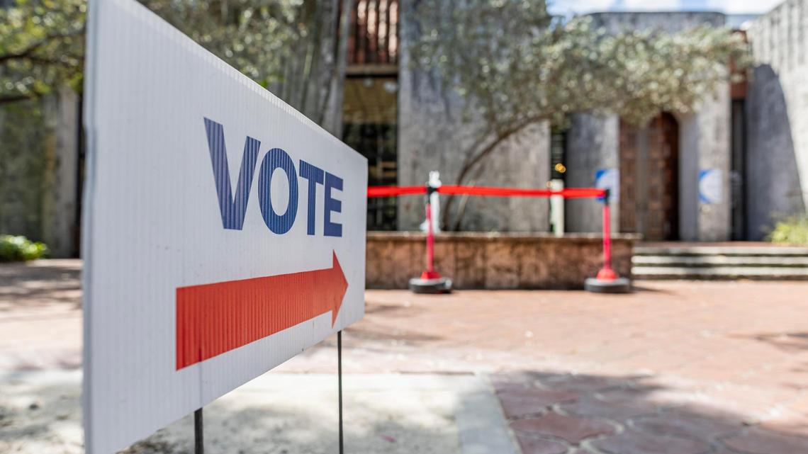 Signs directing early voters decorate the Coral Gables Library on Monday, March 4, 2024, in Coral Gables, Fla.