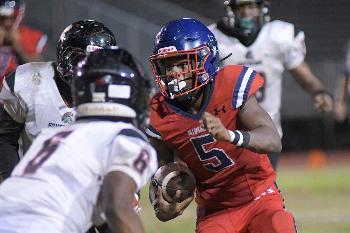Miramar running back Nate Henry carries the ball in a high school football playoff game against Southridge on Friday, Nov. 18, 2022.