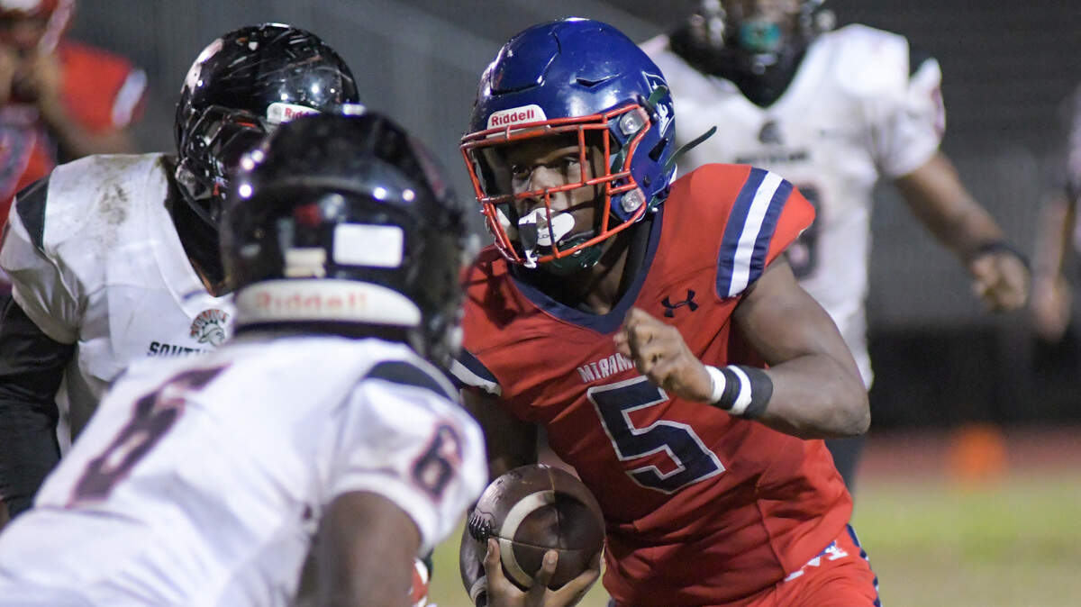 Miramar running back Nate Henry carries the ball in a high school football playoff game against Southridge on Friday, Nov. 18, 2022.