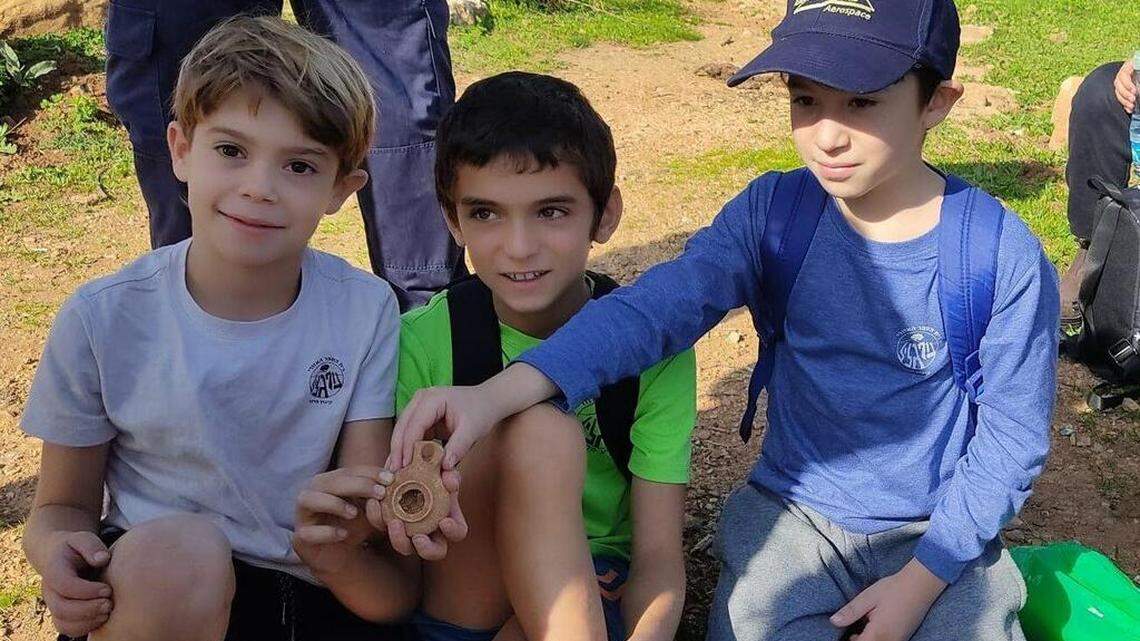Three fourth grade boys walking around kibbutz Parod spotted a special-looking stone and picked up a 2,000-year-old Roman clay oil candle.