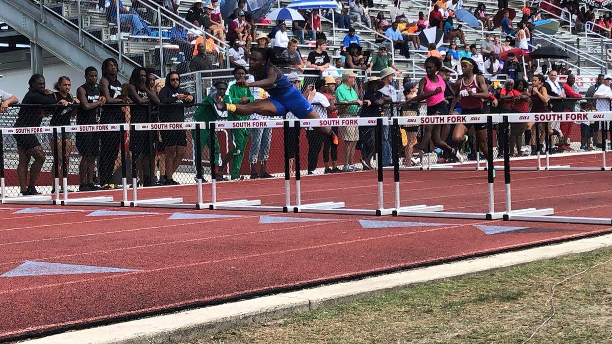 Miami Northwestern High junior Markalah Hart wins the 100 hurdles (13.87) at the Region 3-4A track meet at South Fork High on Saturday. She also won the 300 hurdles (42.86) to help lead the Bulls to the team title.