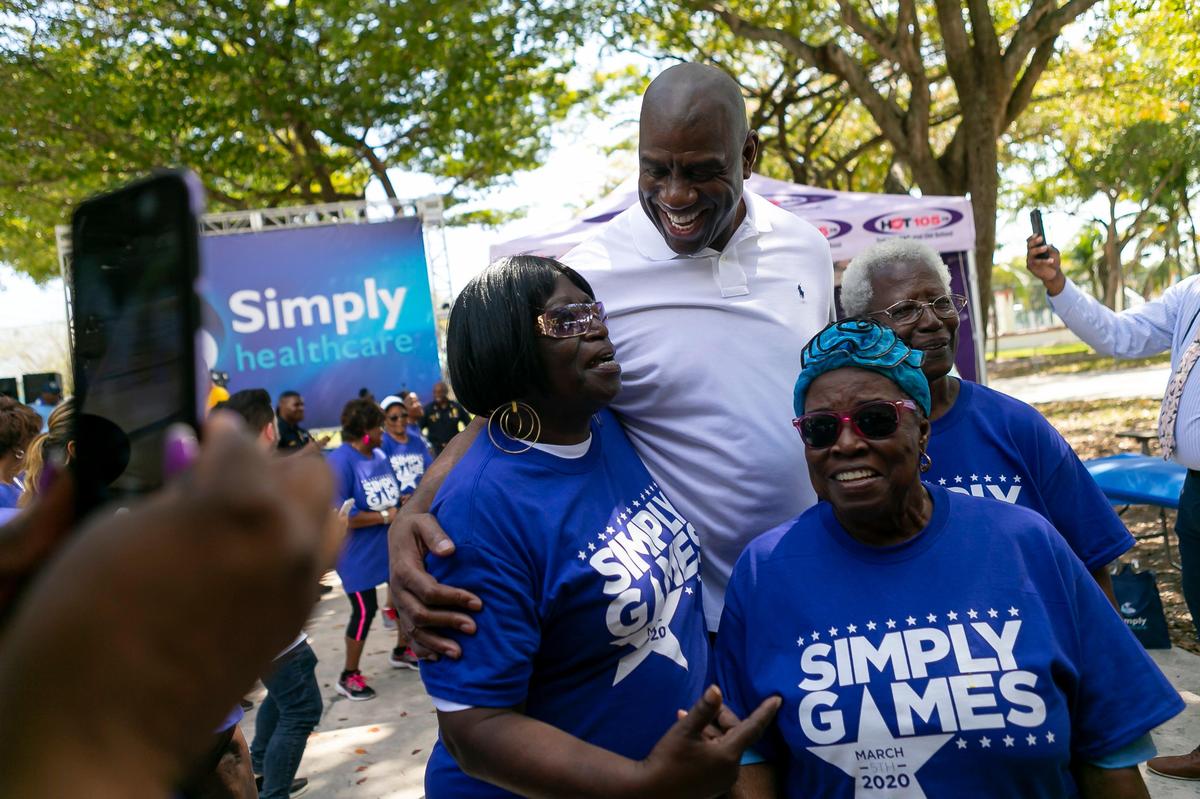 Earvin “Magic” Johnson greets seniors during the Simply Games hosted by Simply Healthcare at Charles Hadley Park on Thursday, March 5, 2020.