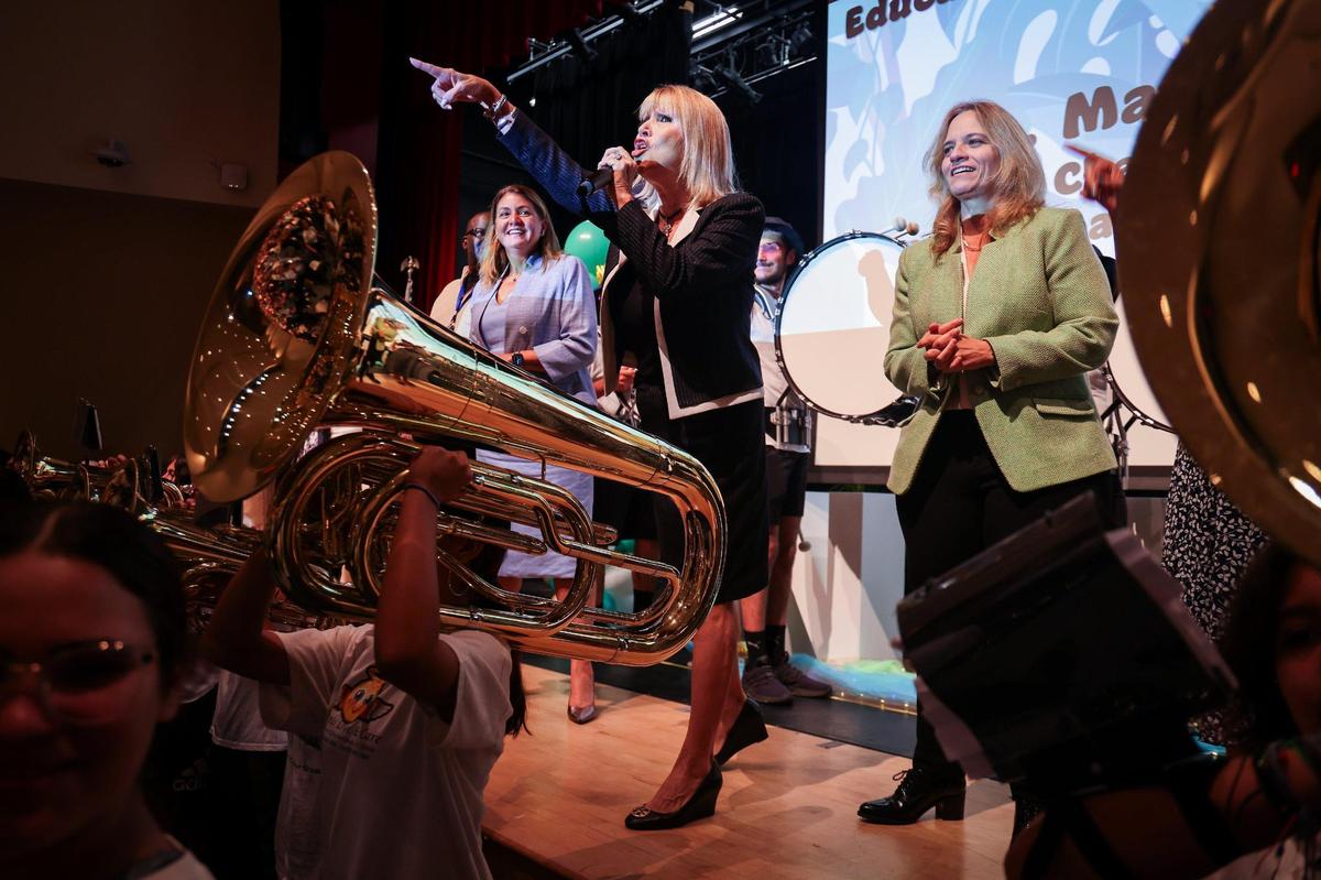 School Board of Miami-Dade County Chair Ms. Mari Tere Rojas, center, leads the audience of about 450 new teachers in a cheer as the high school’s band performed at the New Teacher Orientation at Hialeah Gardens Senior High on Monday, August 7, 2023.