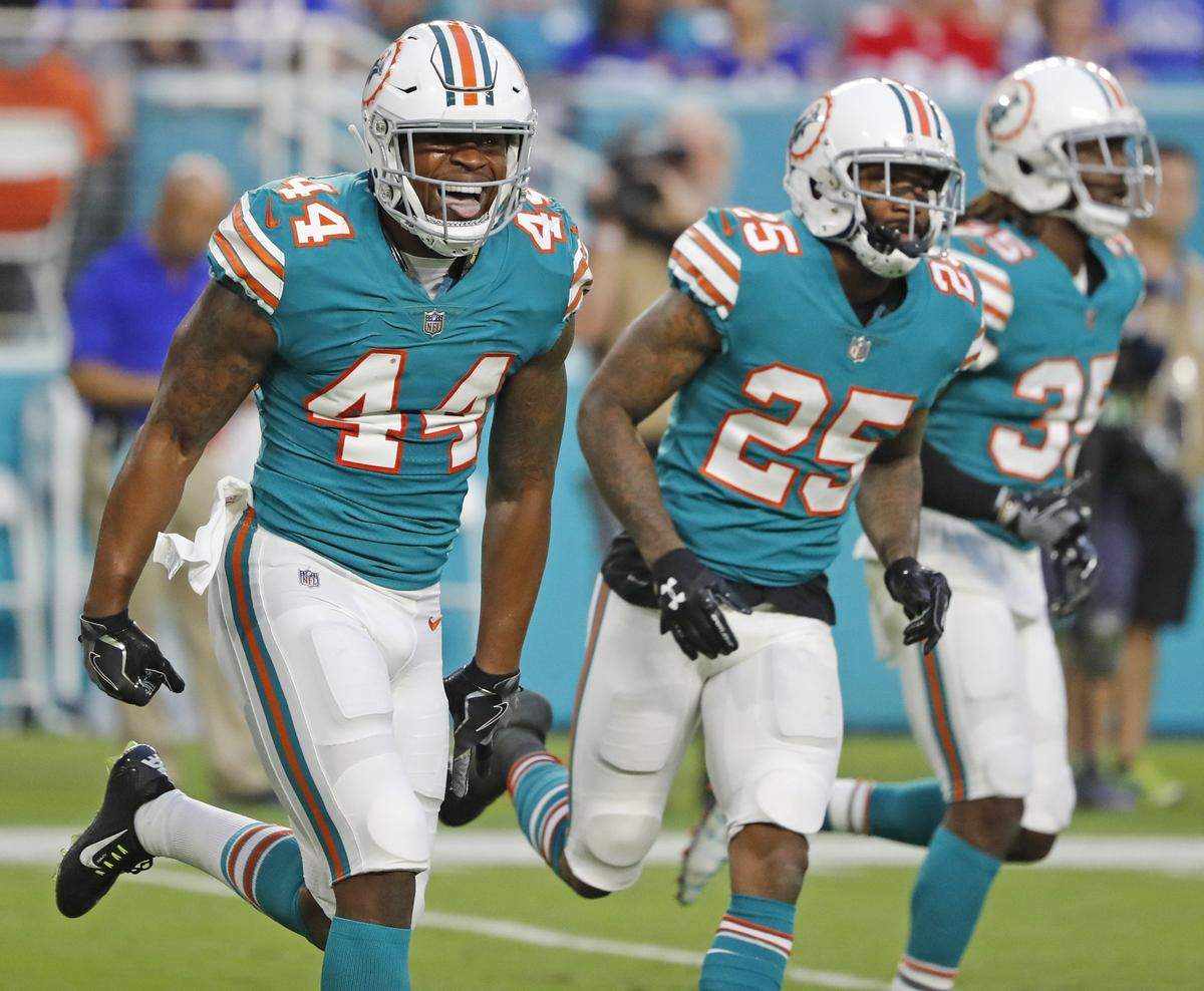 Miami Dolphins outside linebacker Stephone Anthony (44) celebrates after stopping Buffalo Bills fullback Mike Tolbert (35) from getting a first down in the second quarter as the Miami Dolphins host the Buffalo Bills at Hard Rock Stadium on Sunday, December 31, 2017.