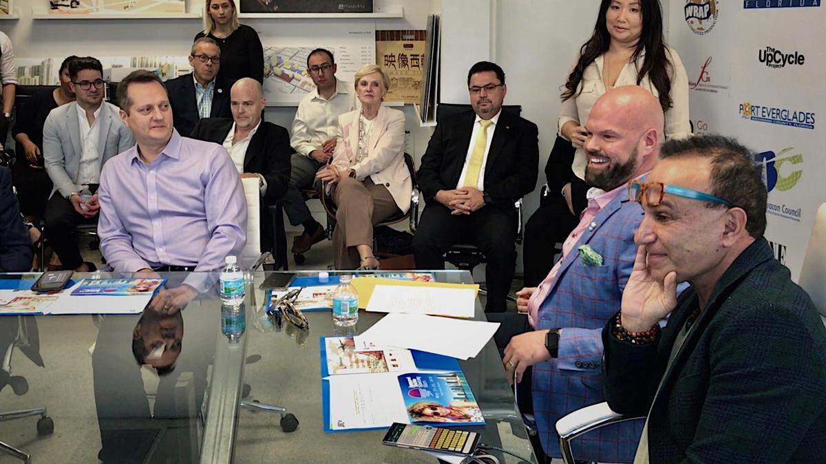 Miami is getting its first apparel trade show in years — one that comes with a major Chinese footprint. At right is show creator Jason Prescott, South Florida liaison for the China chamber and, in the foreground, Miami developer Moishe Mana, the event's landlord.
