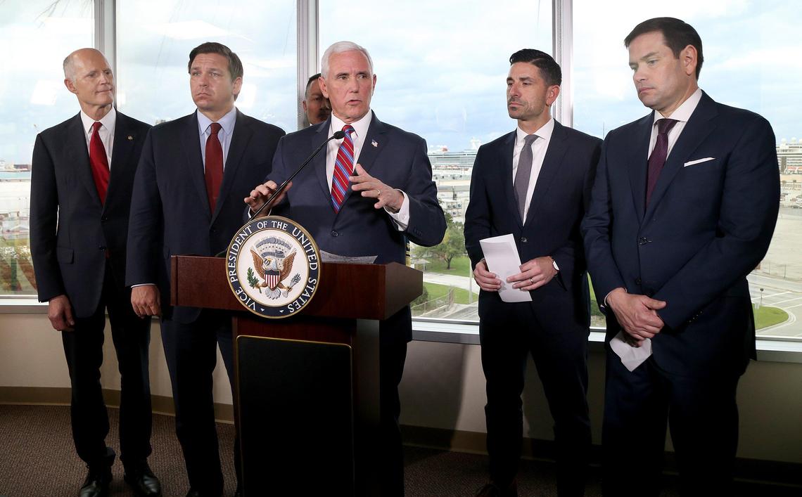 U.S. Vice President Mike Pence speaks in front of, from left, U.S. Senator Rick Scott, Florida Governor Ron DeSantis, Chad Wolf, Acting Secretary of Homeland Security and Florida Senator Marco Rubio, after a meeting with cruise company executives to discuss the coronavirus response at Port Everglades Administration Building in Fort Lauderdale, on Saturday, March 7, 2020.