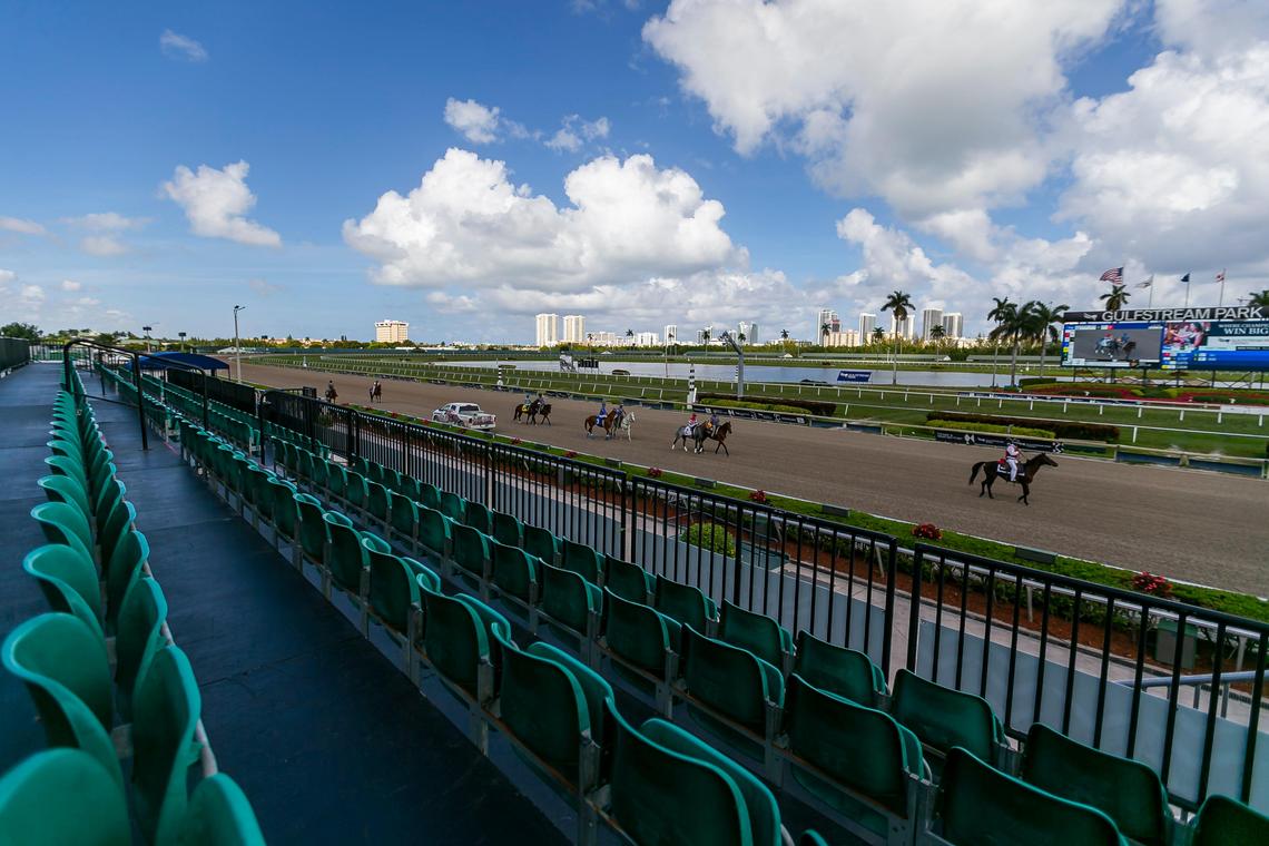 Empty seats can be seen as jockeyÕs and their horses arrive to the track before the start of a race at Gulfstream Park Racing and Casino in Hallandale Beach, Florida on Friday, March 13, 2020. Organizers have decided to continue racing horses but are preventing fans from attending the event due to fears of possible COVID-19 transmissions.