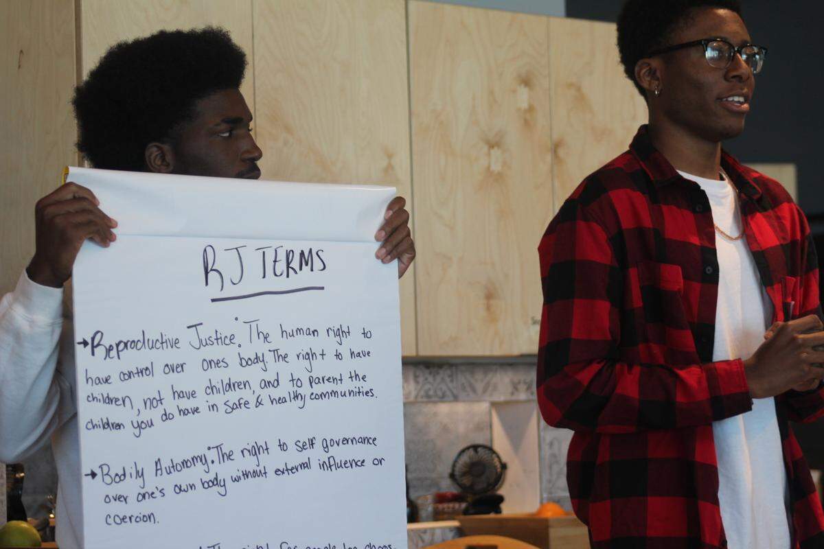 Tech alumni Marc Lamour and Thomas Bryant discuss Power U issues at a workshop held before the nonprofit had to switch to remote learning in the pandemic.