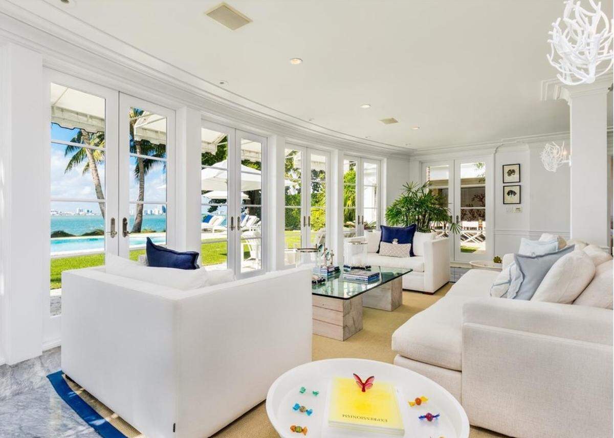 This is an entertainment and lounge area with a view of Biscayne Bay in the home of J. Christopher Burch, after he bought it in February 2020. Fabio Lopes, a sales associate with Coldwell Banker Realty, represented Burch in the purchase.