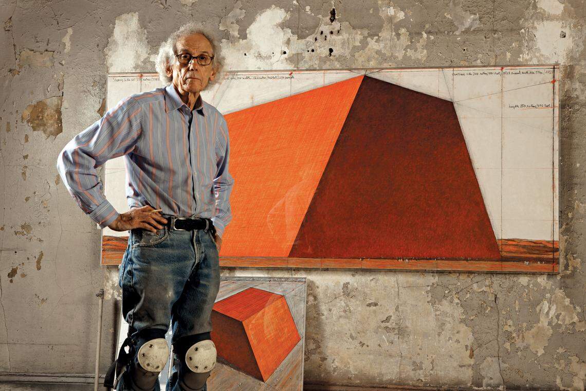 Artist Christo in his studio in 2012 with a preparatory drawing for his latest work, The Mastaba, in Abu Dhabi. The sculpture, made of 400,000 multi-colored barrels, will be the largest in the world and Christo's only permanent installation.