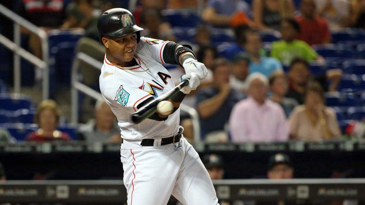 Miami Marlins second baseman Starlin Castro (13) singles to center in the first inning as the Miami Marlins host the Washington Nationals at Marlins Park on Thursday, July 26, 2018.