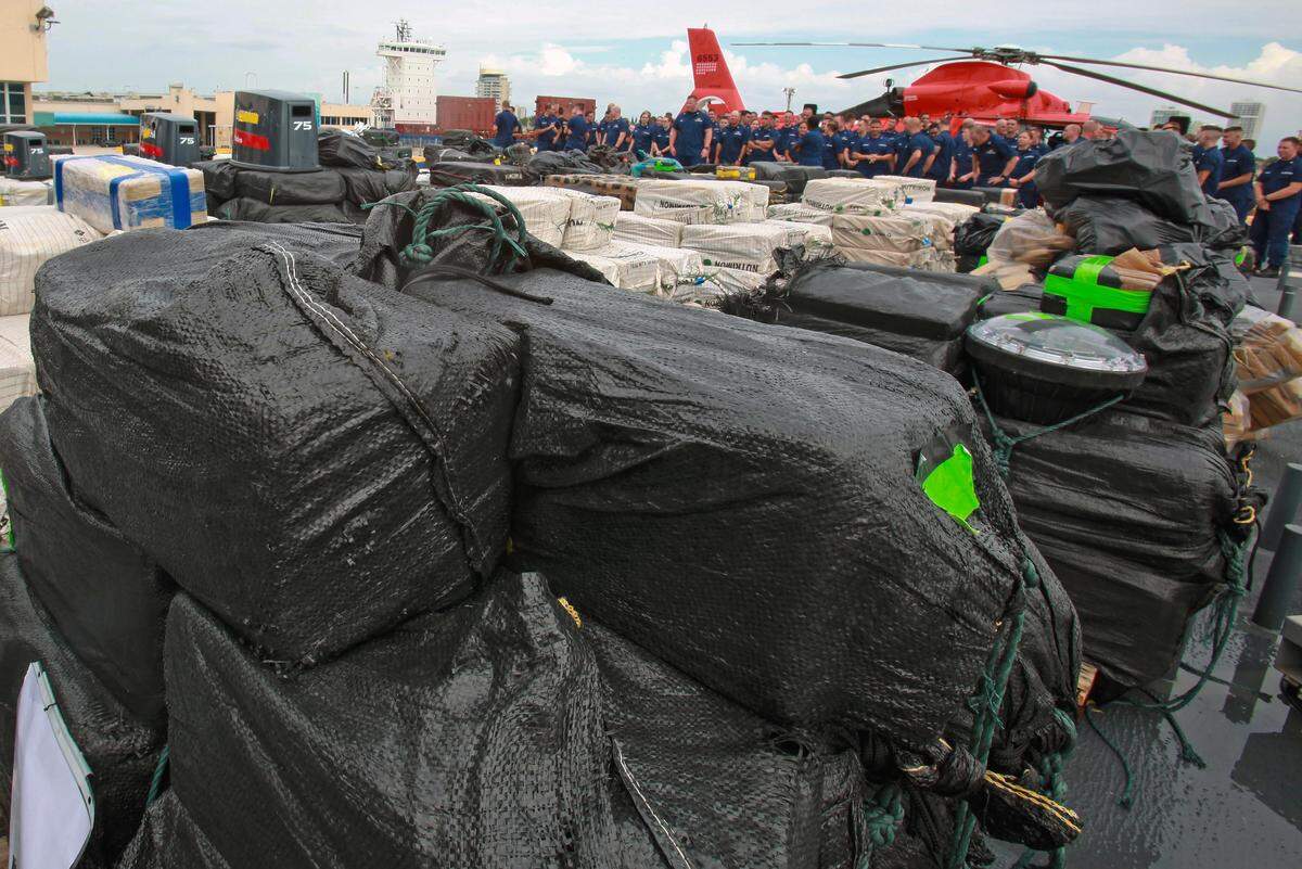 Members of the U.S. Coast Guard offload approximately 37,000 pounds of cocaine at Port Everglades on Thursday, Nov. 15, 2018.