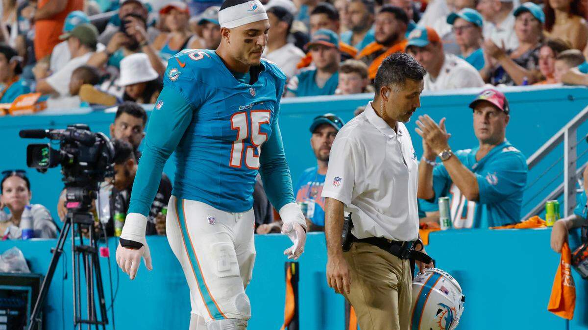Miami Dolphins linebacker Jaelan Phillips (15) leaves the game in the second half of an NFL game against the Tennessee Titans at Hard Rock Stadium on Monday, September 30, 2024, in Miami Gardens, Fla.