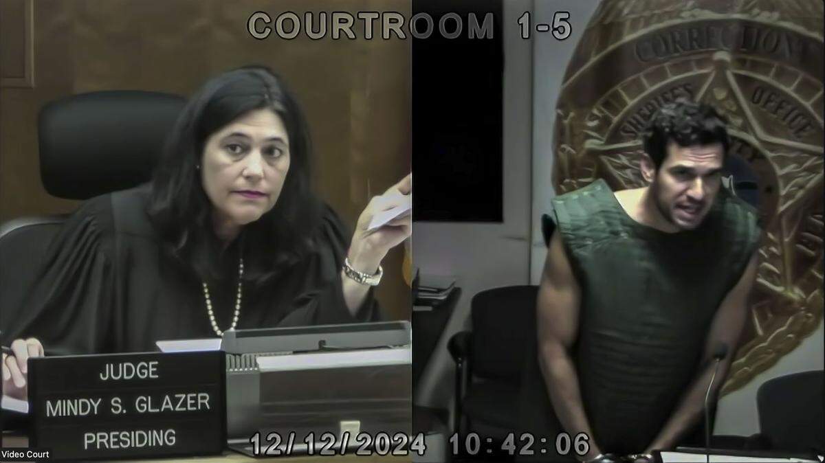 Miami, Florida, Dec. 12, 2024 - Frame grab from video, Oren Alexander, wearing a vest to prevent suicide in jail, speaks to Judge Mindy Glazer, left, during a hearing in Miami-Dade Circuit Court. Glazer ordered him detained until a formal bond hearing on Friday. Alexander was arrested Wednesday at his Miami Beach home and charged with a slew of state and federal sex trafficking and rape crimes.