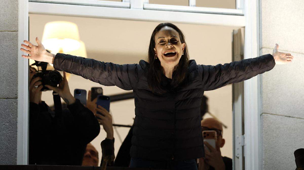 Nobel Peace Prize laureate Maria Corina Machado greets supporters from a balcony of the Grand Hotel in Oslo, Norway, early on December 11, 2025. Machado arrived in Oslo hours after the Venezuelan opposition leader's award was collected on her behalf by her daughter. 