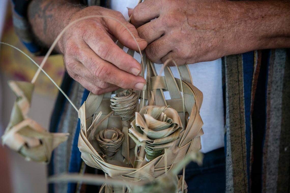 Dale Silvia holds a piece of artwork he gave Sami Rudnick-Hoover, LCSW, many years ago as he speaks to a small group of reporters gathered at Jackson Memorial Perdue Medical Center on Monday, June 21, 2021.