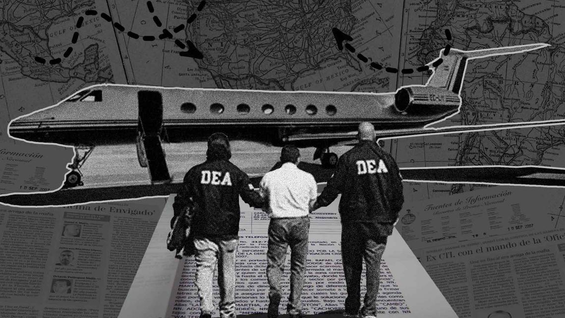A drug suspect is escorted to an awaiting plane by DEA agents.