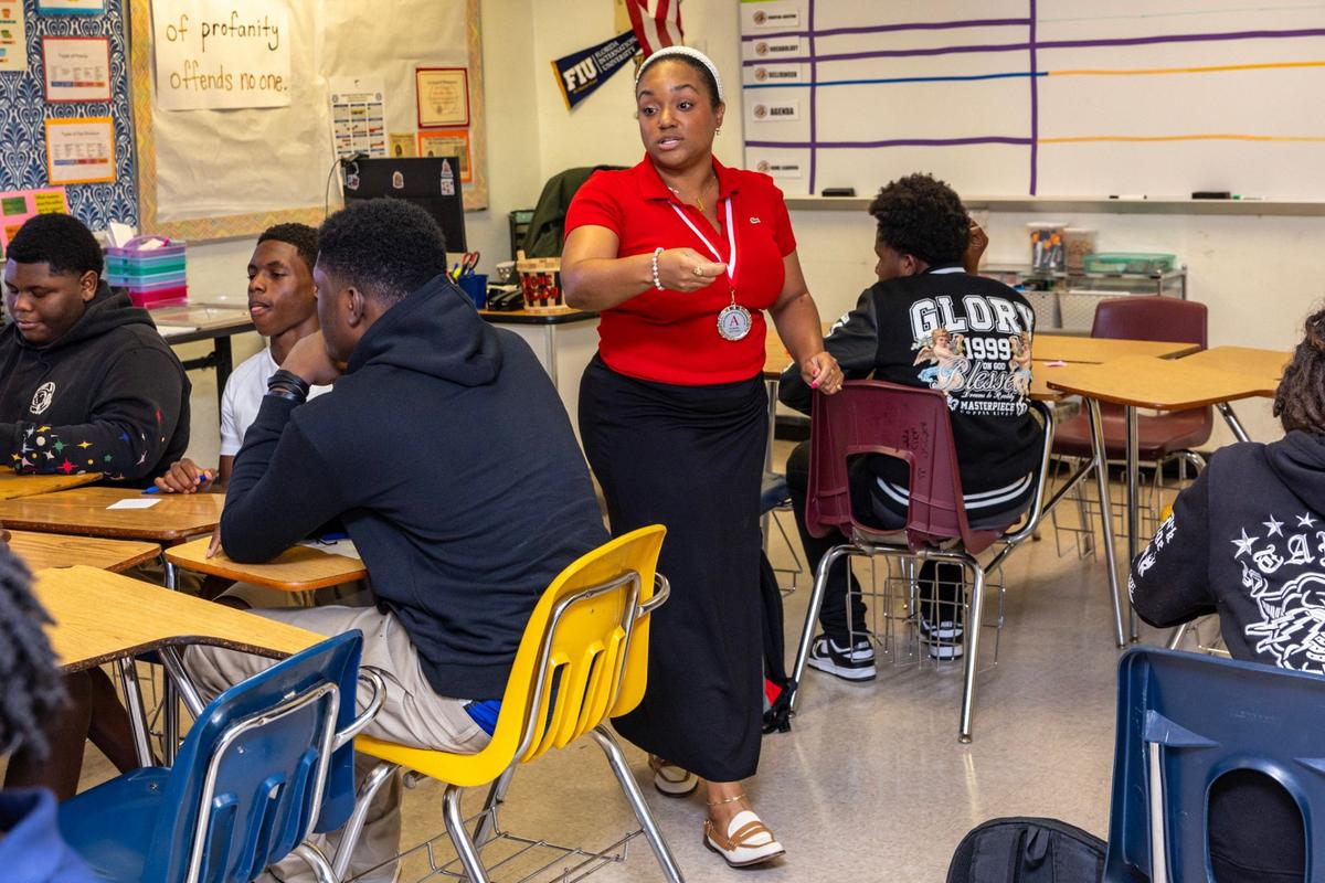 An English teacher speaks with her students during the first day of school at Miami Edison High on Thursday, August 15, 2024, in Miami, Fla.