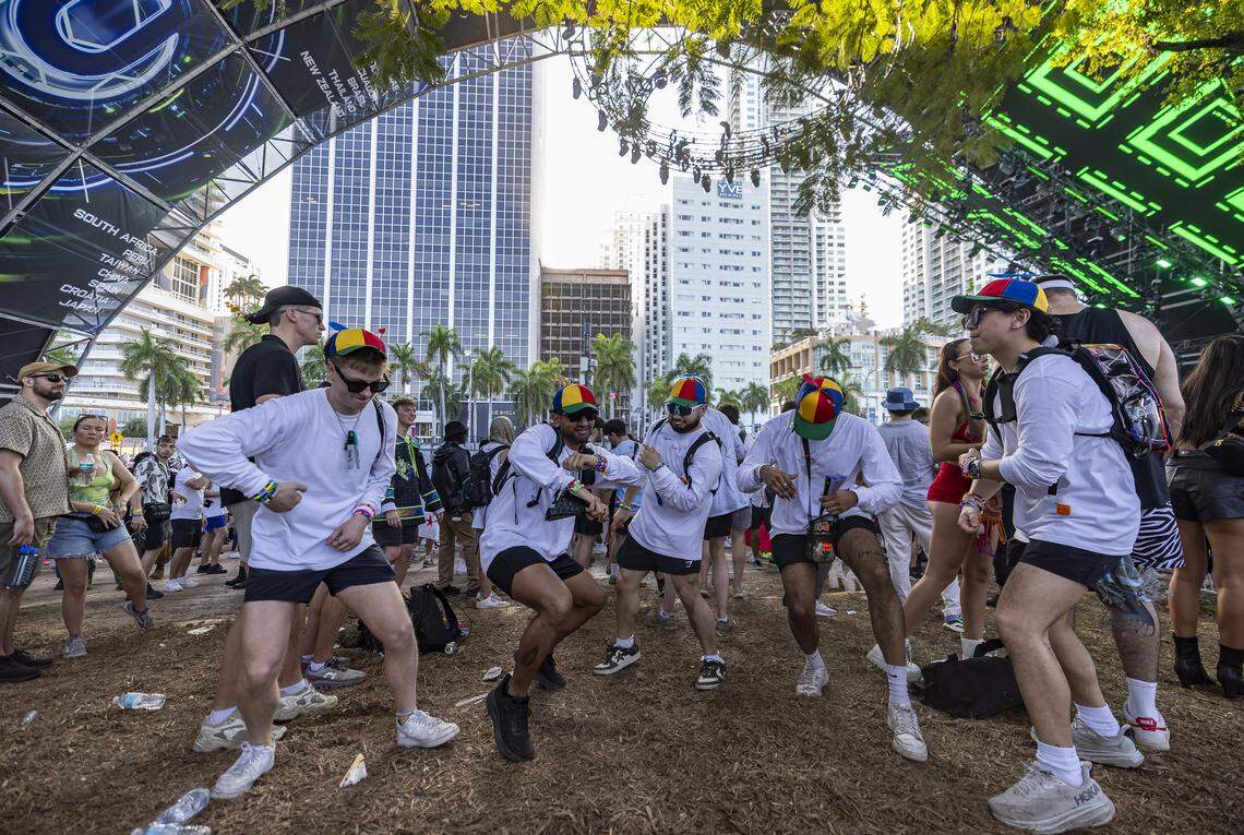 From left to right: Eric Schoiber, Taqi Syed, Bryan Ortega,  Golam Nashman and Huey Nguyen dance as Bou performs during Ultra Music Festival’s 26th anniversary at Bayfront Park on Saturday, March 28, 2026, in downtown Miami, Fla.
