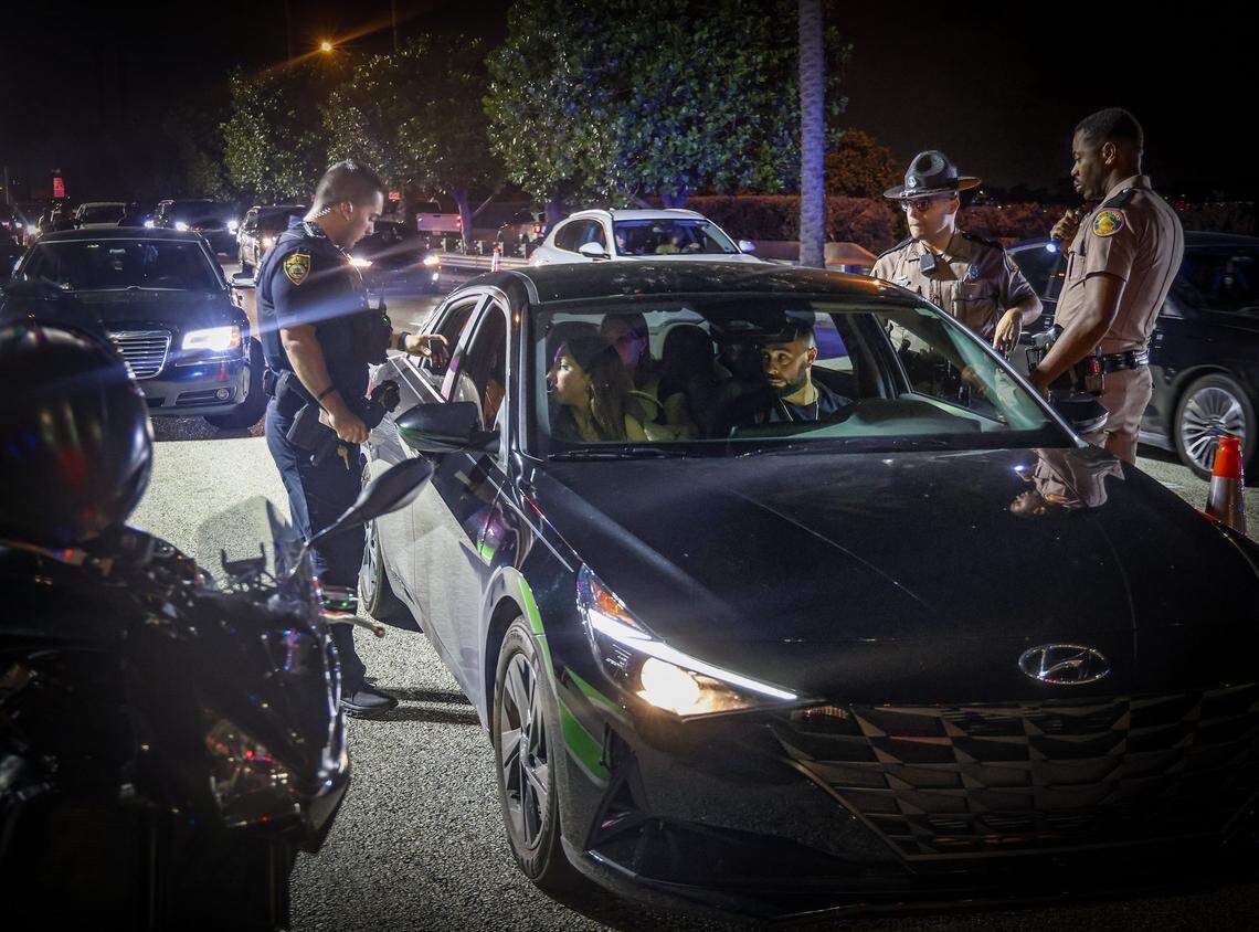 In the evening, traffic slows to a standstill into Miami Beach from the MacArthur Causeway as city officers and Florida Highway Patrol deputies began a license plate reader detail on Sunday, March 10, 2024.