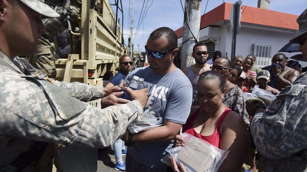 Last year, National Guardsmen distributed water and food among those affected by Hurricane Maria, in San Juan, Puerto Rico.
