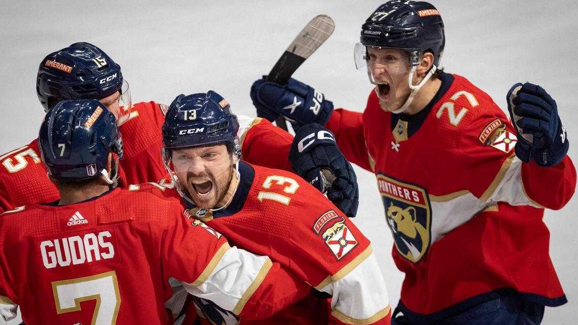 Florida Panthers center Sam Reinhart (13) screams while hugging defenseman Radko Gudas (7), center Eetu Luostarinen (27), and center Anton Lundell (15) after scoring the game winning goal in overtime of Game 3 of the Eastern Conference second-round NHL Stanley Cup series on Sunday, May 7, 2023, at FLA Live Arena. The Florida Panthers won 3-2.