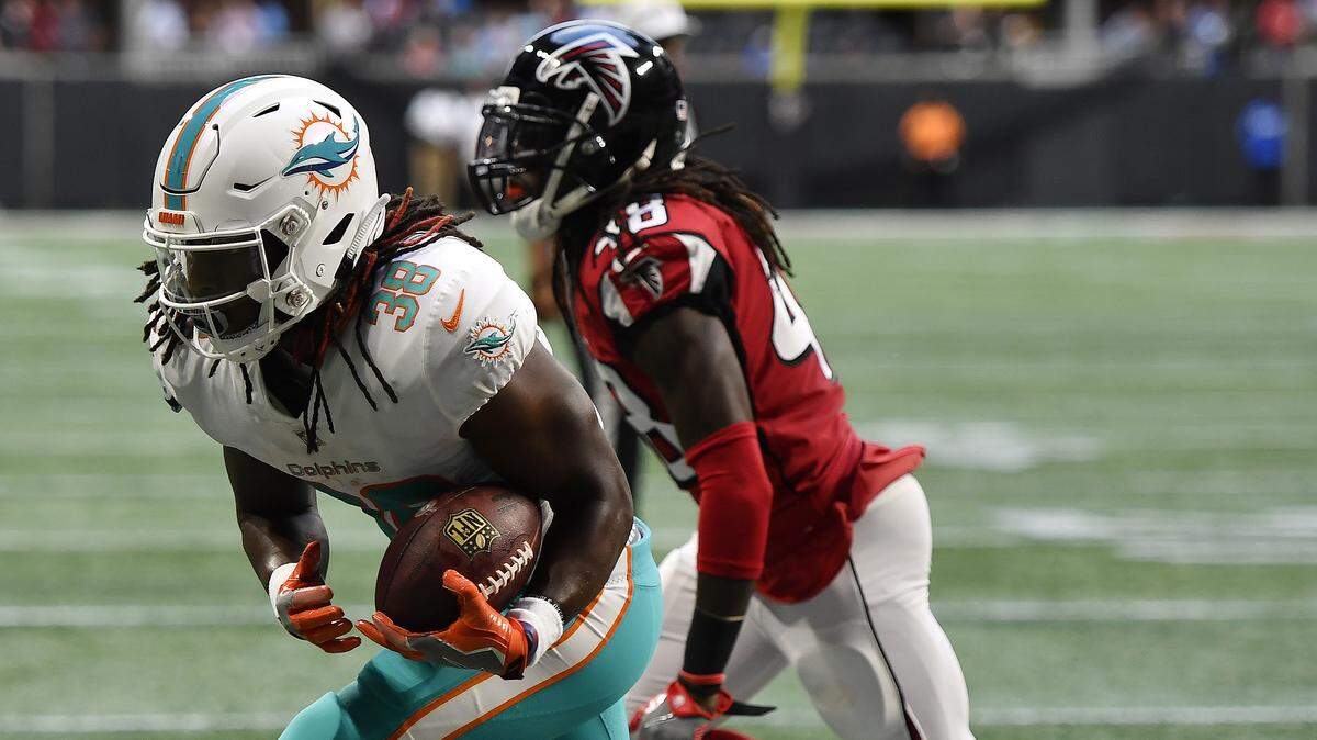 Miami Dolphins running back Buddy Howell (38) makes a touchdown catch against Atlanta Falcons defensive back Ron Parker (48) during the first half of an NFL preseason football game, Thursday, Aug. 30, 2018, in Atlanta.