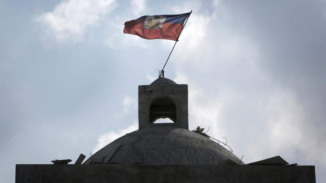 The flag flies atop the Catholic Church in Haiti, rebuilt after it was destroyed in the 2010 earthquake.
